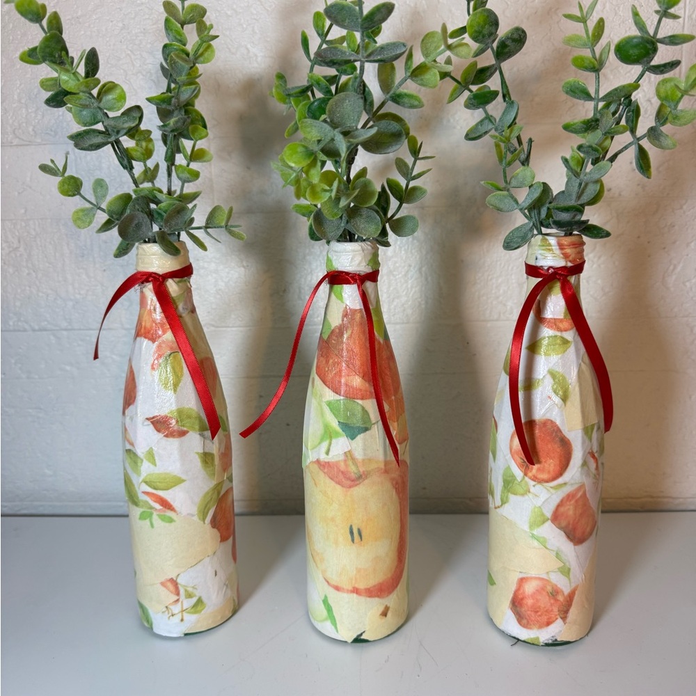 Decorative Bottles with Greenery and Red Accents